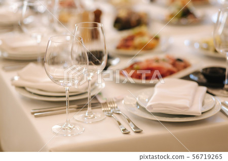 Close up of glasses for vine on the table in the restaurant. Banquet concept Close up of glasses for vine on the table in the restaurant. Banquet concept 56719265