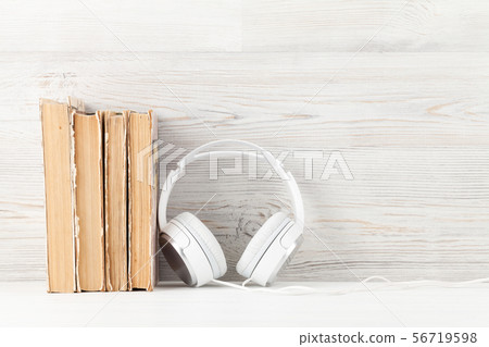 Home office with books and headphones Home office with books and headphones 56719598