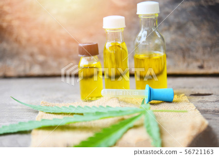 Cannabis oil on bottle products wooden background 56721163
