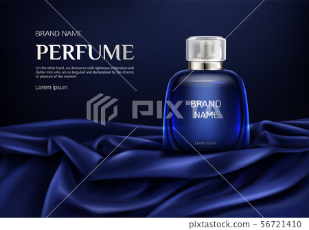 Perfume glass bottle on blue silk folded fabric 56721410