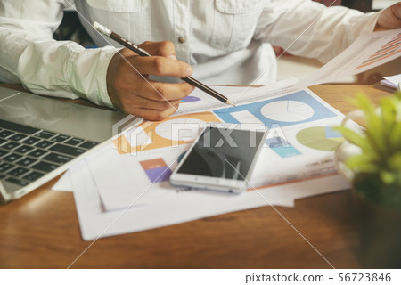 Business woman viewing summary and annual report Business woman viewing summary and annual report 56723846