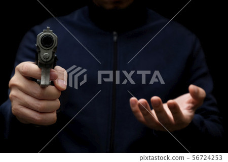 Man Carrying a Toy Gun to Rob the Money. 56724253