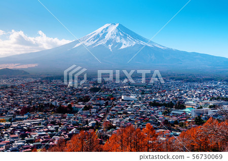 Snow covered Mount Fuji and blue sky autumn view Snow covered Mount Fuji and blue sky autumn view 56730069