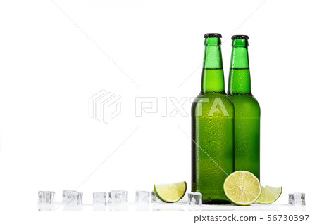 Green bottle of beer and ice cubes 56730397
