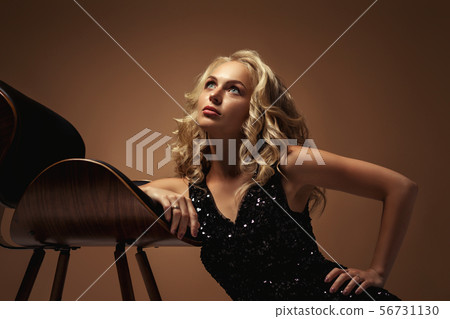 blonde fashion woman in gorgeous black dress blonde fashion woman in gorgeous black dress 56731130