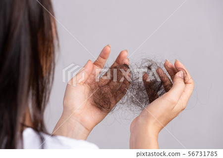 Healthy concept. Woman show her damaged long hair 56731785