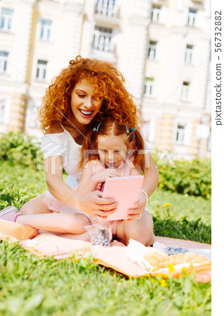 Pretty young parent playing with her daughter Pretty young parent playing with her daughter 56732882