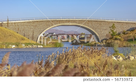 Two bridges over Oquirrh Lake in Daybreak Utah 56733972