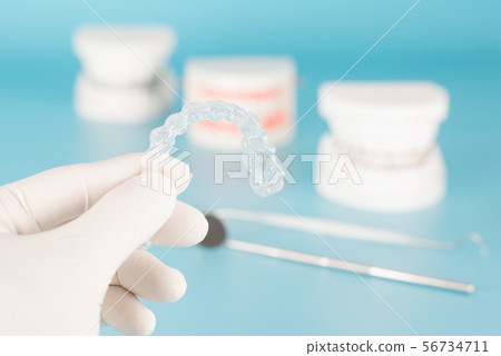 Clear aligner in dental care concept. Clear aligner in dental care concept. 56734711