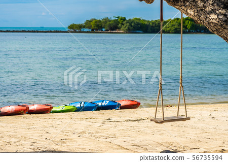 Empty swing seat around beach sea Empty swing seat around beach sea 56735594