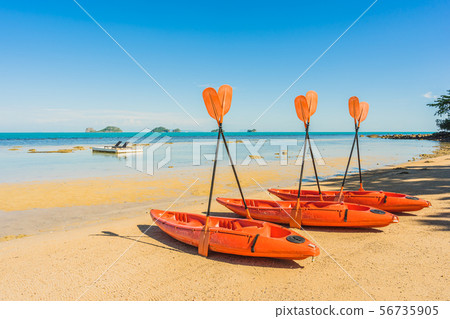 Empty kayak boat or ship on the tropical beach and sea Empty kayak boat or ship on the tropical beach and sea 56735905
