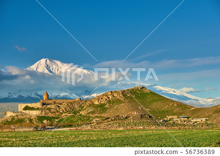 Ancient monastery in front of mountain 56736389