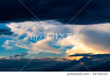 Beautiful sunset sky. Orange, blue, and white sky. 56736528