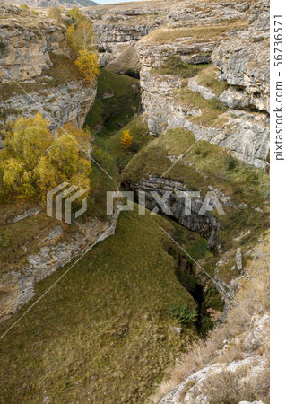 Photo from above of mountainous terrain, hills, vegetation Photo from above of mountainous terrain, hills, vegetation 56736571
