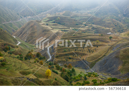 Photo of picturesque mountain landscape with green vegetation, mountain roads on summer 56736618