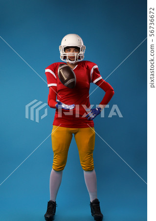 Photo of full length american football player in studio Photo of full length american football player in studio 56736672