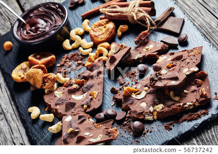 close-up of sweet chocolate bar with cashew close-up of sweet chocolate bar with cashew 56737242