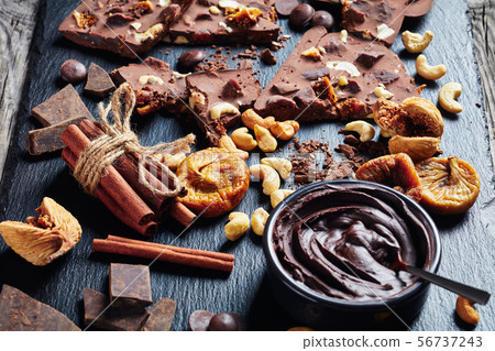 close-up of sweet chocolate bar with dried figs close-up of sweet chocolate bar with dried figs 56737243