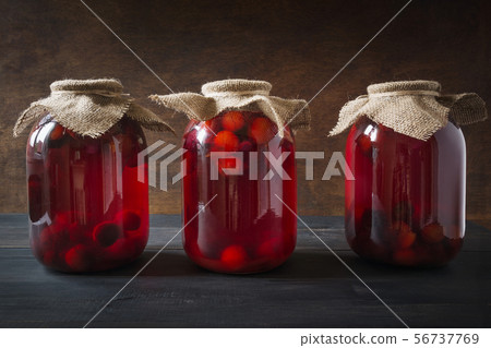 Three homemade canned plum compote in large jars Three homemade canned plum compote in large jars 56737769