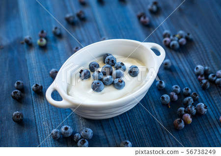 tasty blueberry fruits with cream 56738249