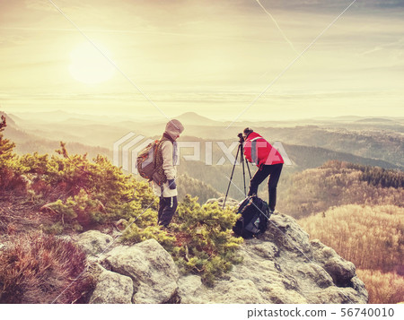 Tourists couple stay on summit and takes memory 56740010