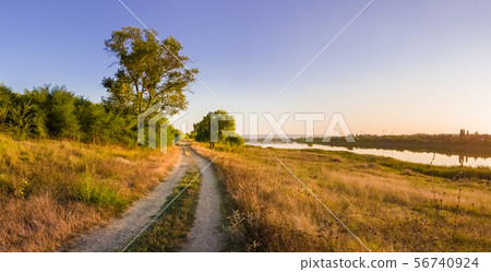Scenic countryside landscape with rural dirt road Scenic countryside landscape with rural dirt road 56740924