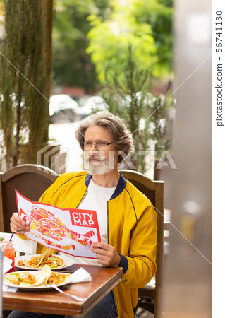 Thoughtful man looking at the city street. 56741130