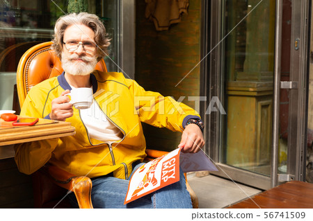 Man drinking his morning coffee thiking over stroll. Man drinking his morning coffee thiking over stroll. 56741509