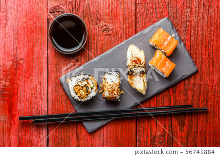 Photo of rolls with chopsticks Photo of rolls with chopsticks 56741884