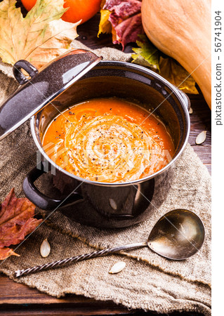 Photo of useful soup puree, pumpkin on linen cloth Photo of useful soup puree, pumpkin on linen cloth 56741904