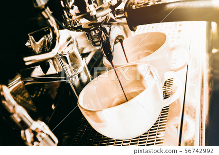 Espresso machine brewing a coffee. Coffee pouring Espresso machine brewing a coffee. Coffee pouring 56742992