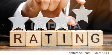 Businessman puts a fourth star  56743811