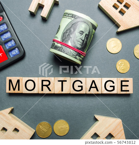 Wooden houses, a calculator, keys 56743812