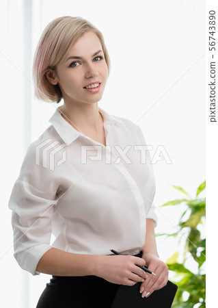 Young beautiful blonde girl with short hair in... - Stock Photo [56743890]  - PIXTA