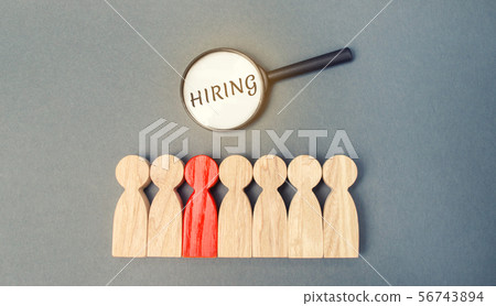 Magnifying glass with the word Hiring  56743894