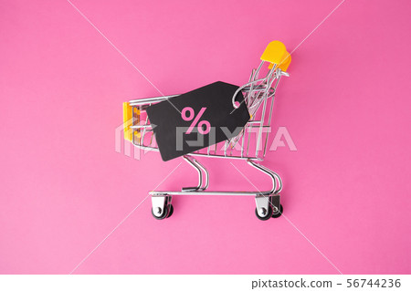 Shopping cart with sale tag on pastel pink Shopping cart with sale tag on pastel pink 56744236