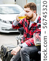 Young Man Drinks Beer 56745320