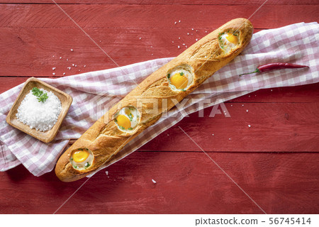 Baked eggs in baguette bread. Breakfast with eggs 56745414