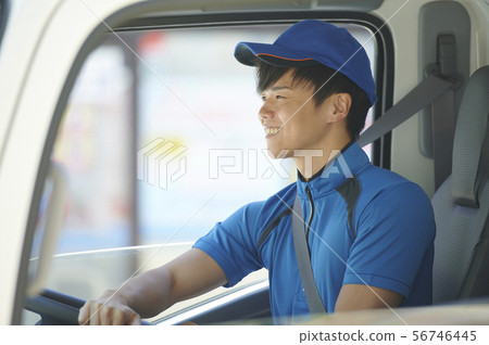 Male truck driver driving Male truck driver driving 56746445