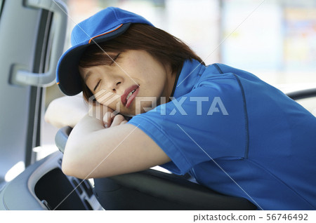 Female truck driver sleeps