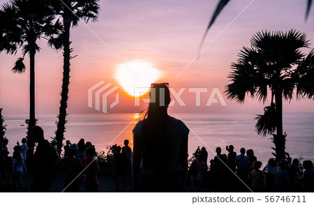 Sunset girl woman sea on pink background. 56746711