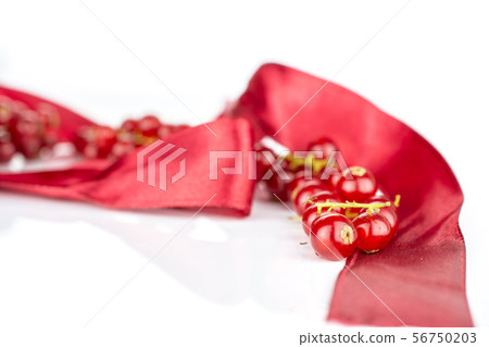 Fresh red currant isolated on white Fresh red currant isolated on white 56750203