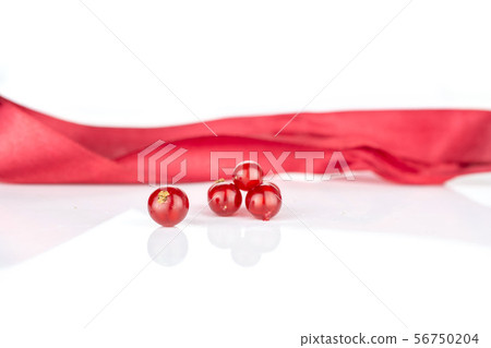 Fresh red currant isolated on white Fresh red currant isolated on white 56750204
