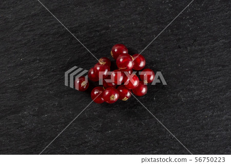 Fresh red currant on grey stone Fresh red currant on grey stone 56750223