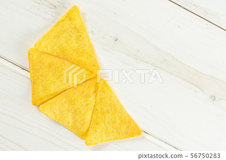 Tortilla cheese chips on grey wood 56750283