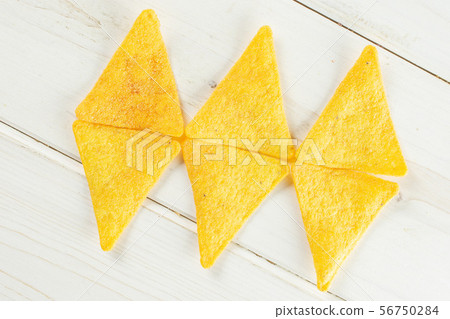 Tortilla cheese chips on grey wood 56750284
