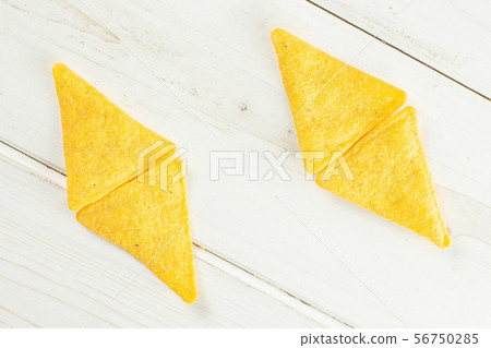 Tortilla cheese chips on grey wood 56750285