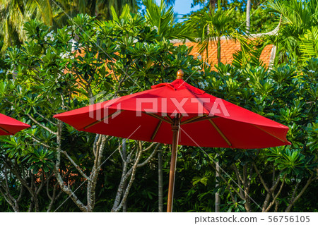 Beautiful umbrella and chair around outdoor swimming pool in hotel resort for holiday vacation travel Beautiful umbrella and chair around outdoor swimming pool in hotel resort for holiday vacation travel 56756105
