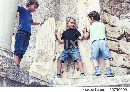 little boy exploring ancient architecture, lifestyle people on summer vacation close up 56756609