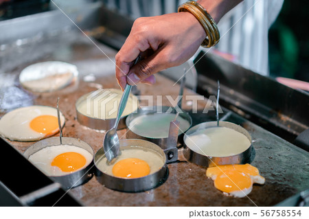 Cooking Fried Eggs on Pan Cooking Fried Eggs on Pan 56758554